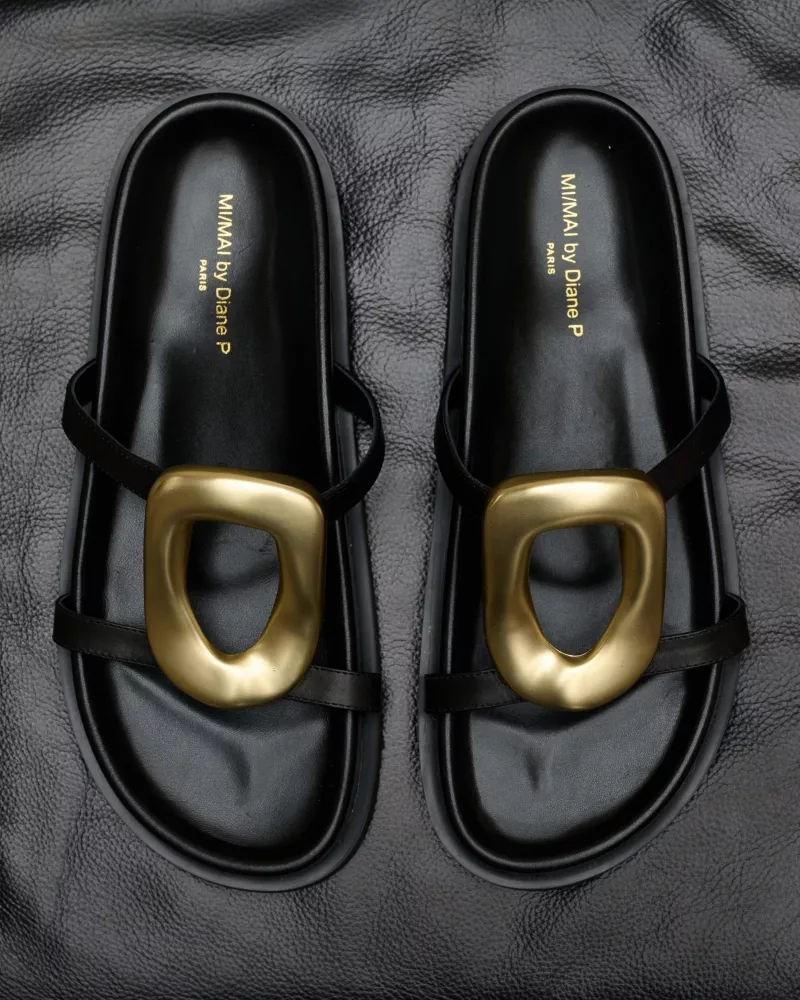 Milos Black Flat Sandals in black leather, gold ornament and chunky outsole