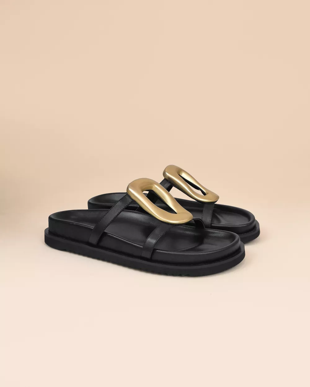Milos Black Flat Sandals in black leather, gold ornament and chunky outsole
