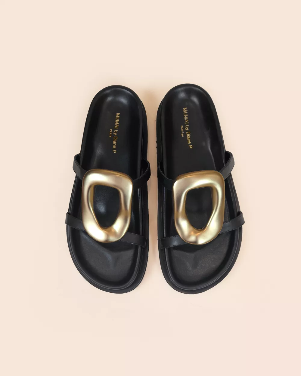 Milos Black Flat Sandals in black leather, gold ornament and chunky outsole