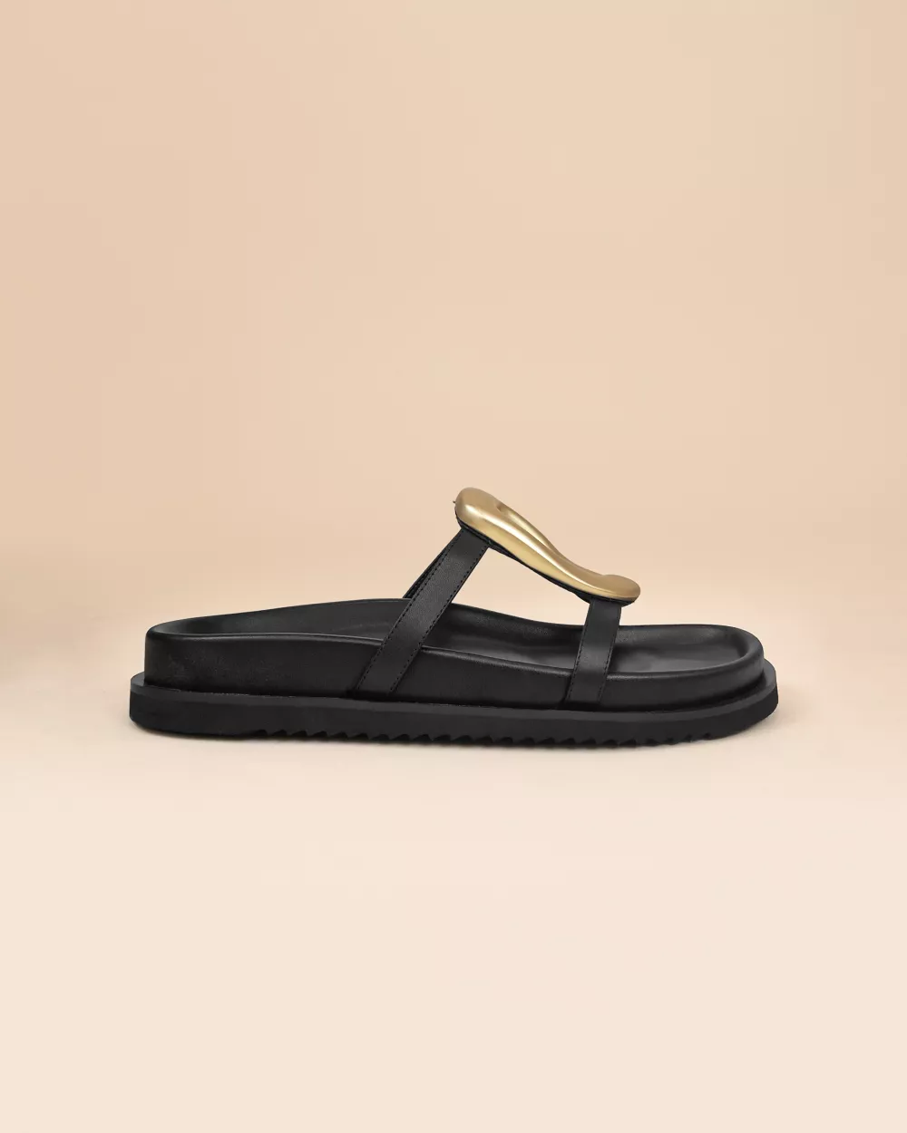 Milos Black Flat Sandals in black leather, gold ornament and chunky outsole